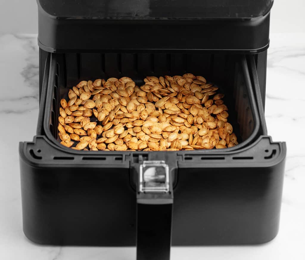 Roasted Pumpkin Seeds in Air Fryer Basket