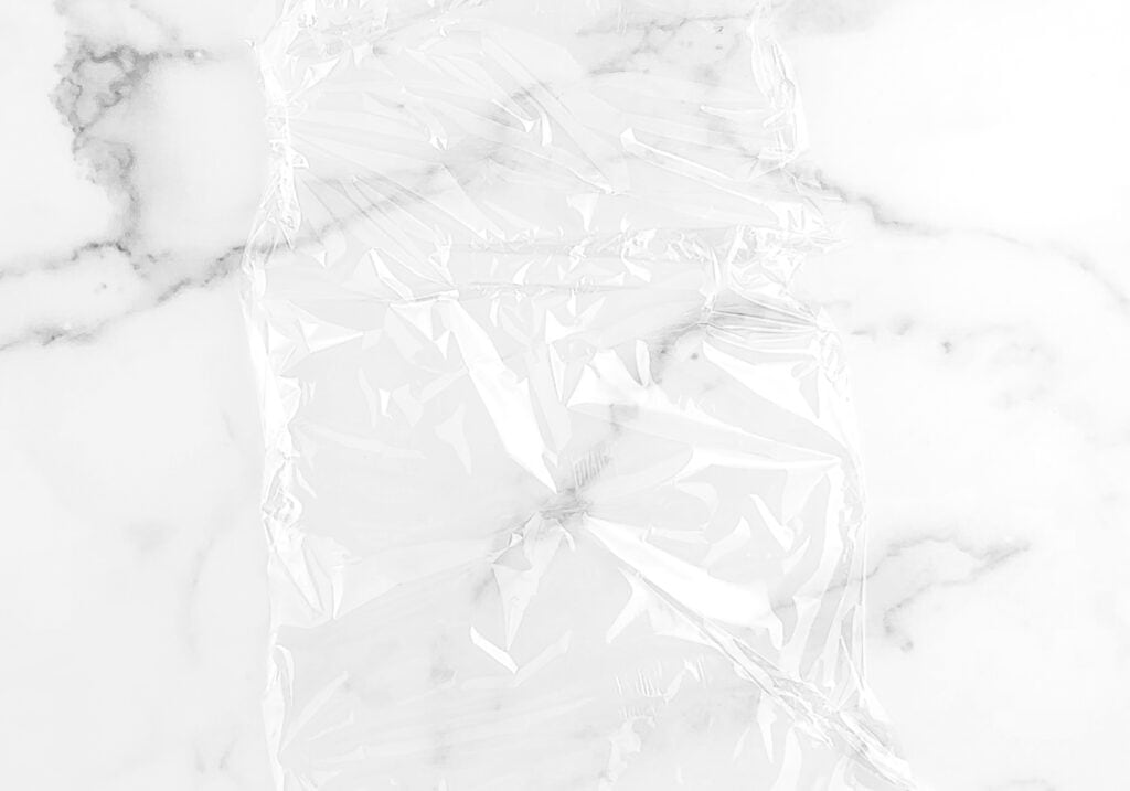 Sheet of Plastic Wrap on Marble Countertop