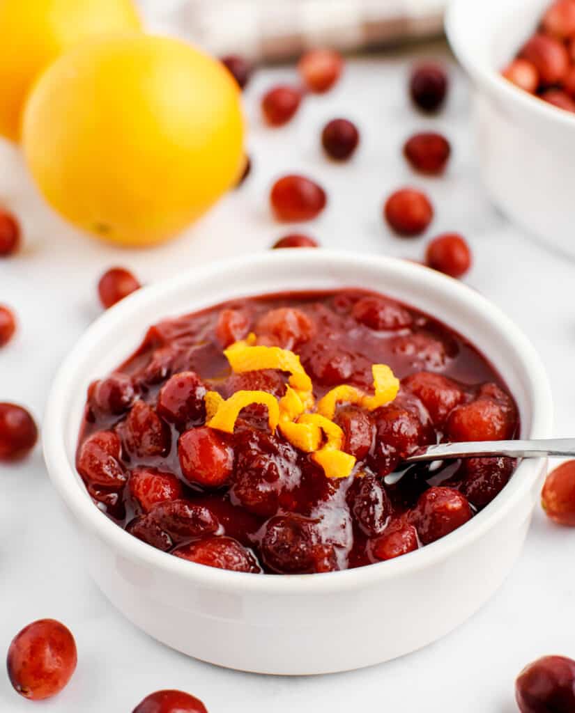 Cranberry Sauce in Bowl with Orange Zest and Spoon