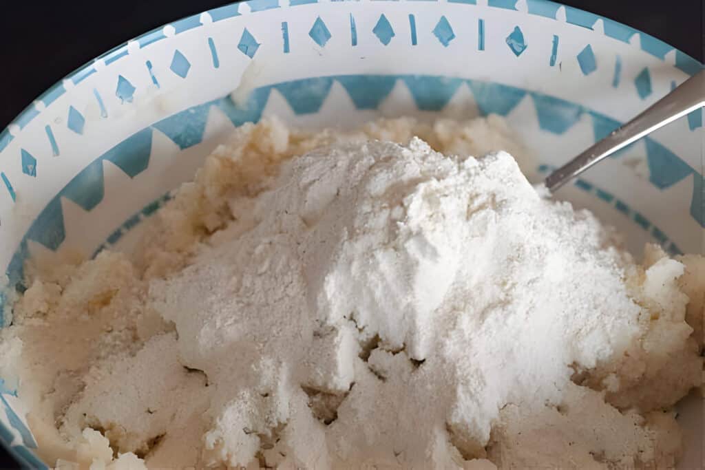 Adding Flour to Lefse Dough Mixture