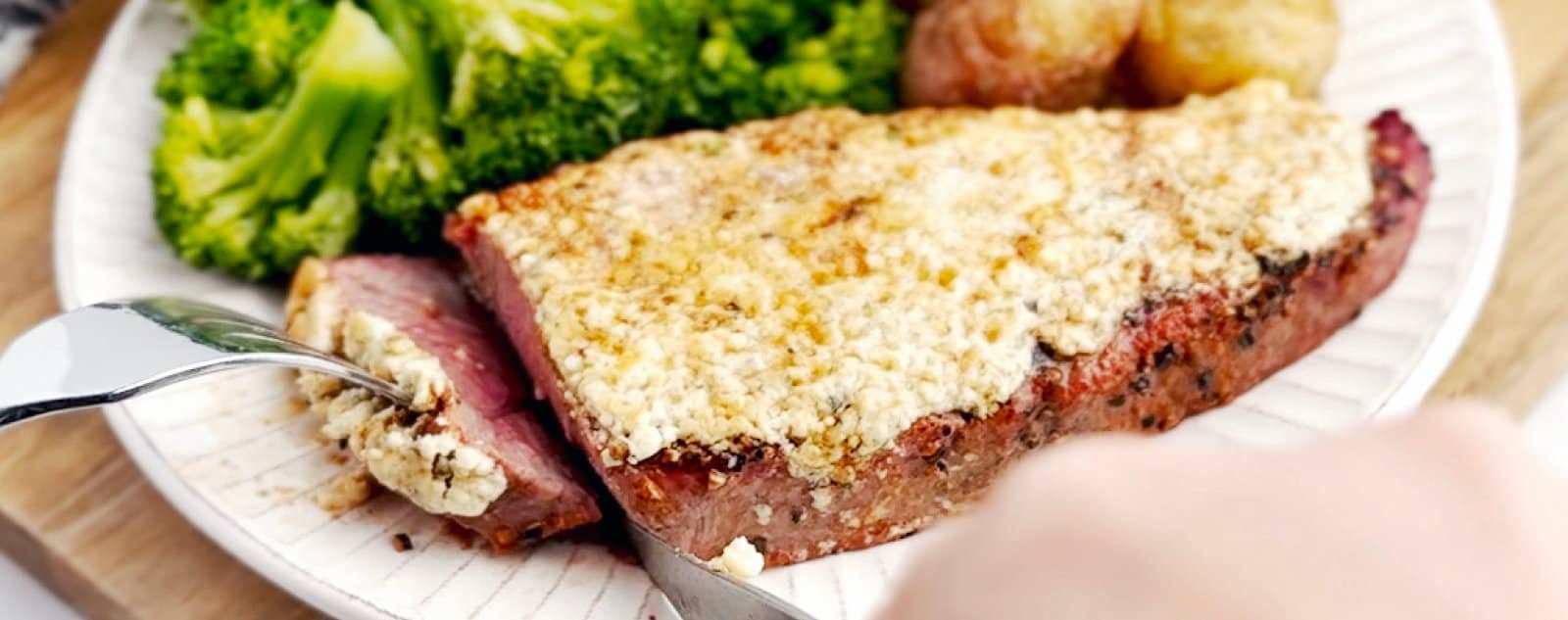 Steak with Gorgonzola Butter Plated with Broccoli and Potatoes