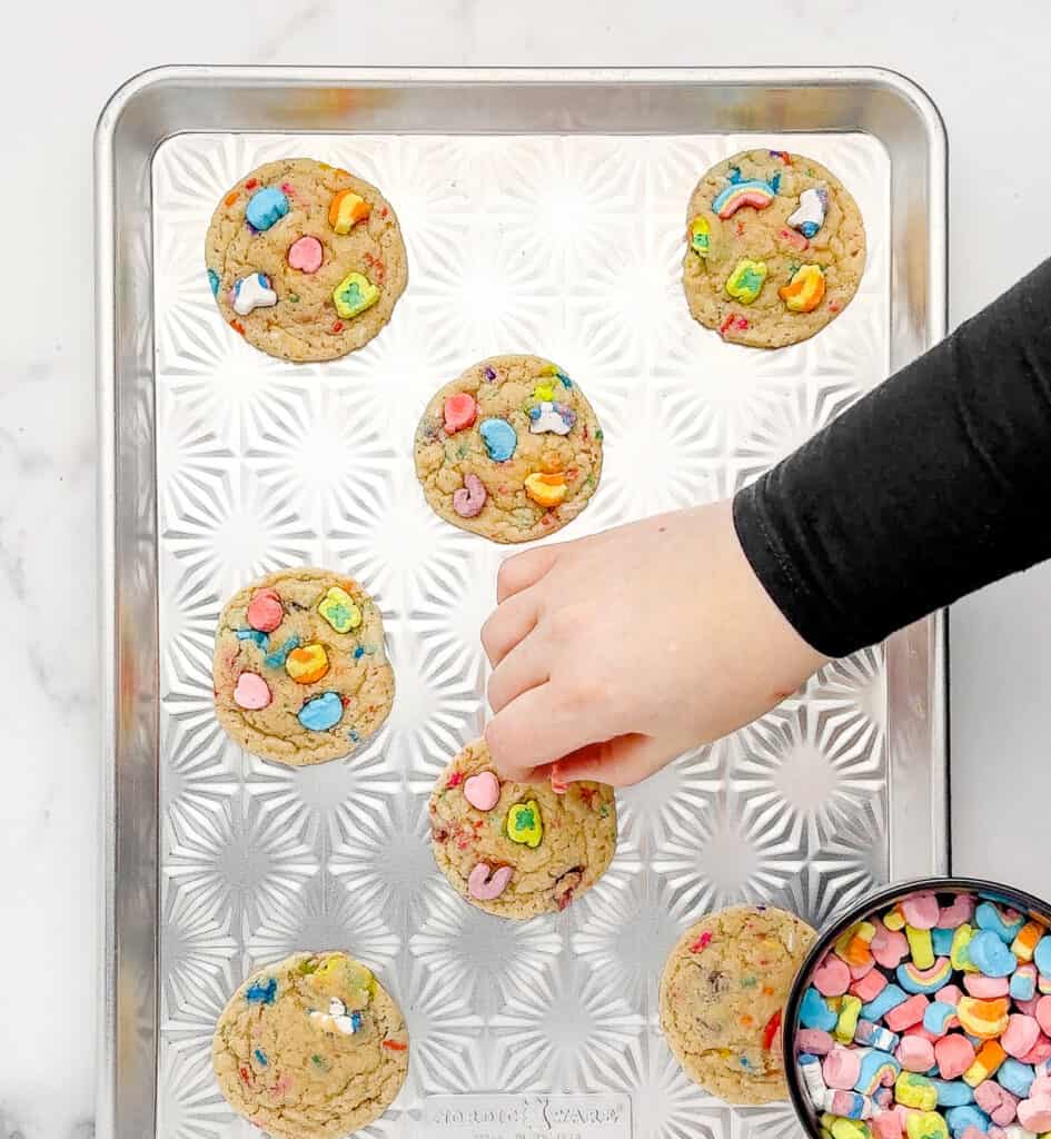 Adding Marshmallows to Baked Cookies on Cookie Sheet