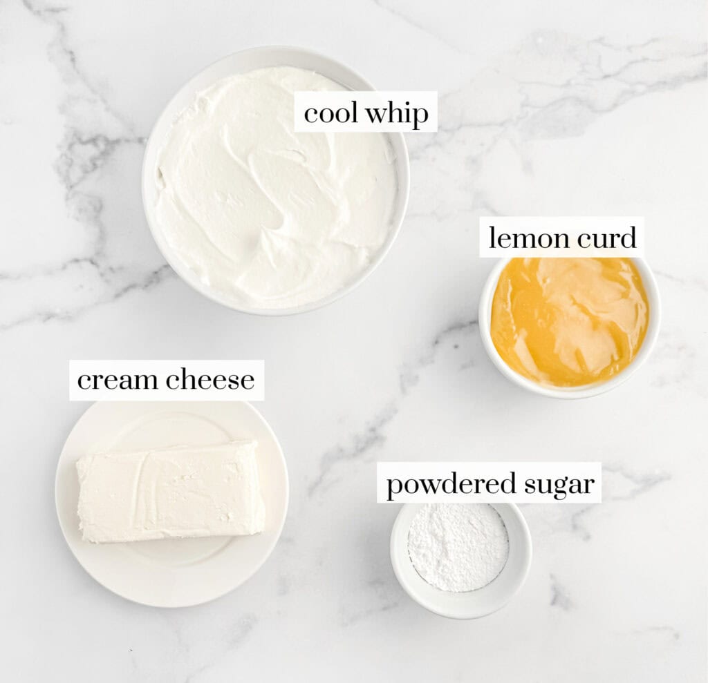 Cool Whip, Cream Cheese, Lemon Curd, and Powdered Sugar in White Bowls on Marble Surface