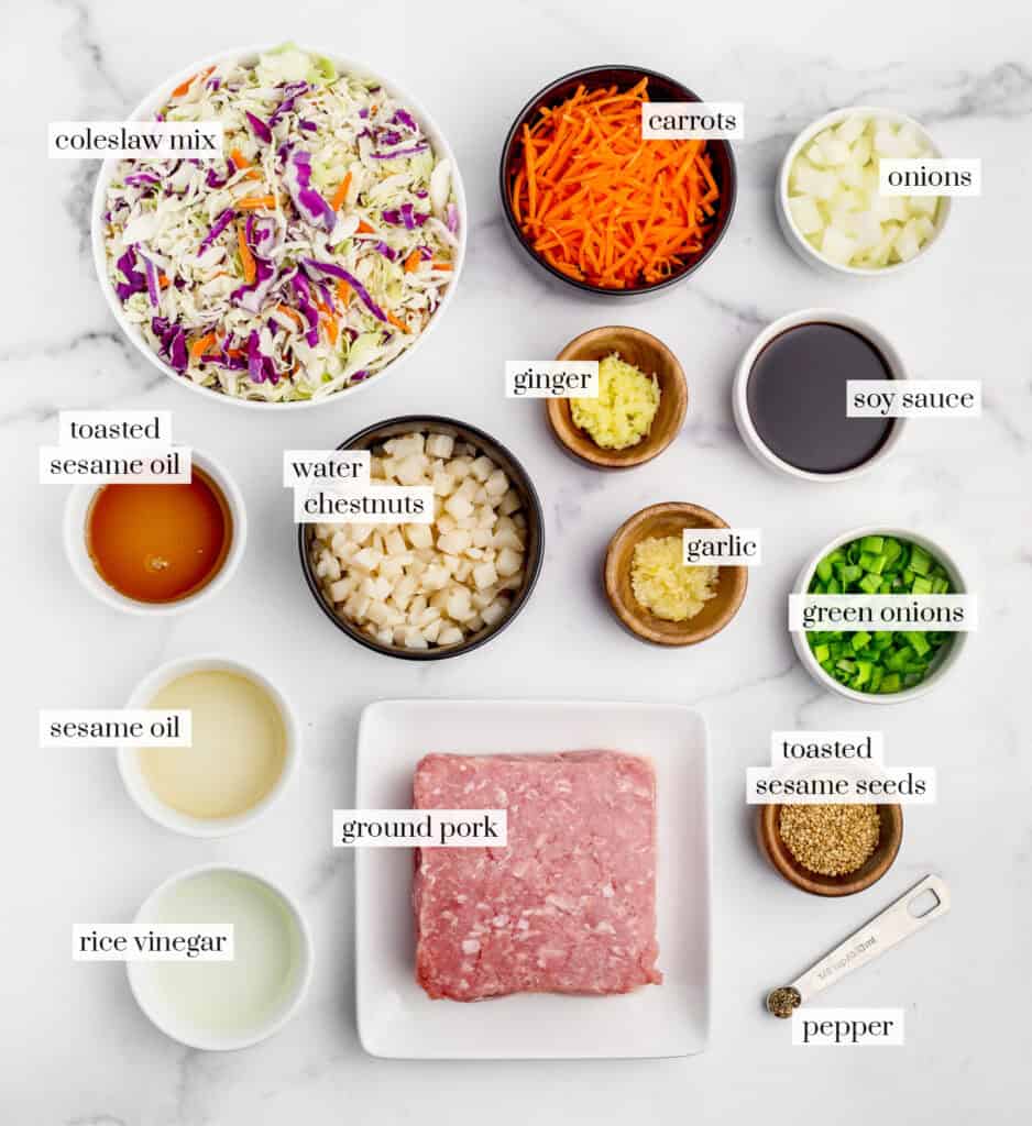 Egg Roll in a Bowl Ingredients in Bowls on White Marble Surface
