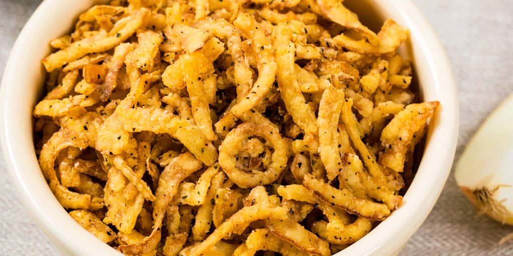 Crispy Fried Onions in White Bowl