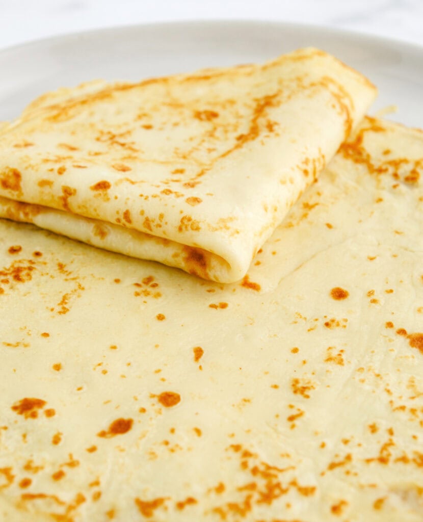 Folded Crepe on top of Stack of Crepes
