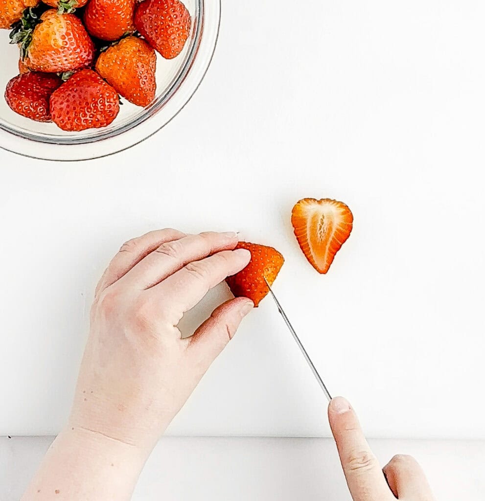 Cutting Triangle into the Top of a Strawberry to Form the V of the Heart