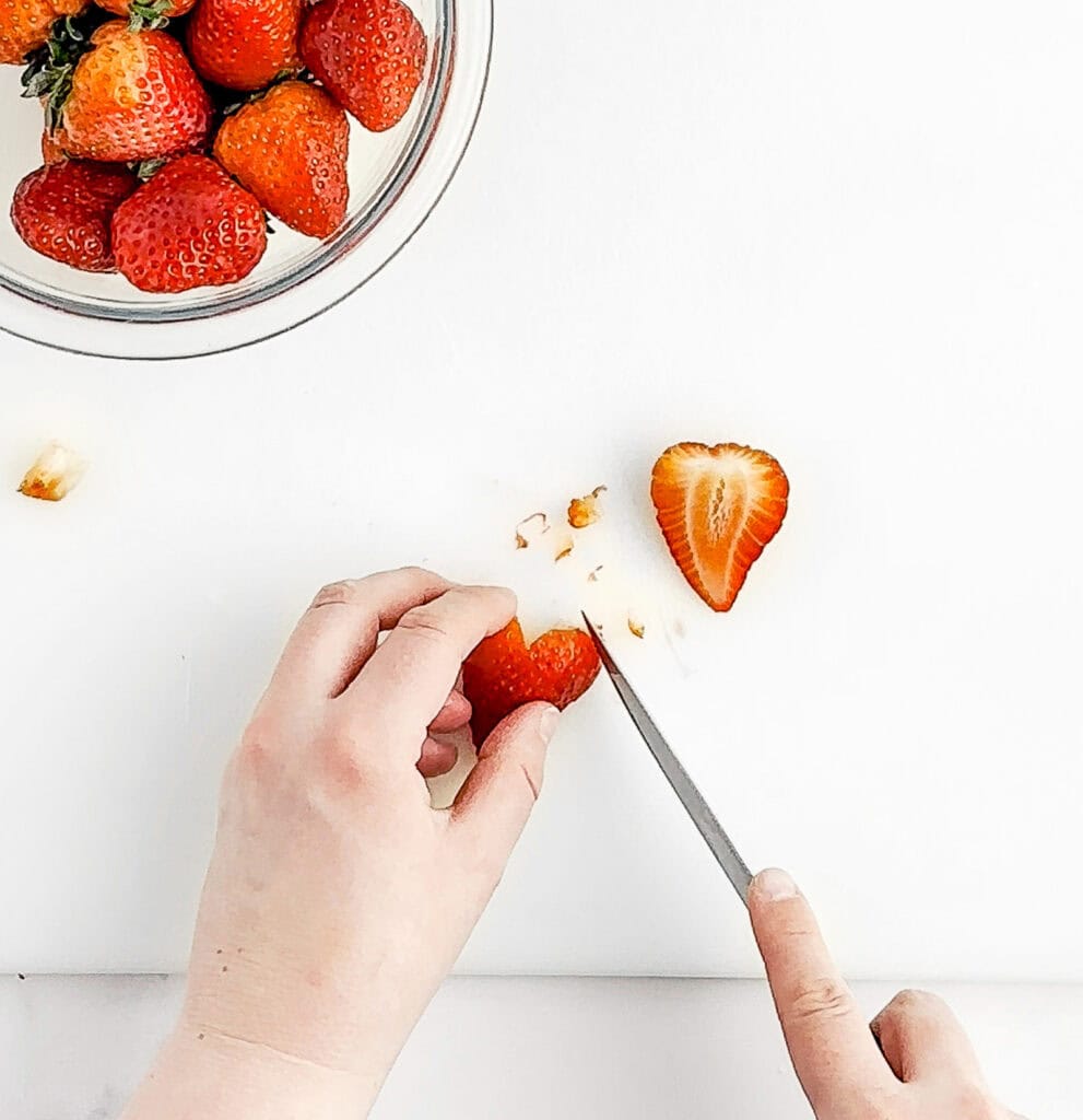 Rounding Shape of Heart in a Strawberry with a Knife