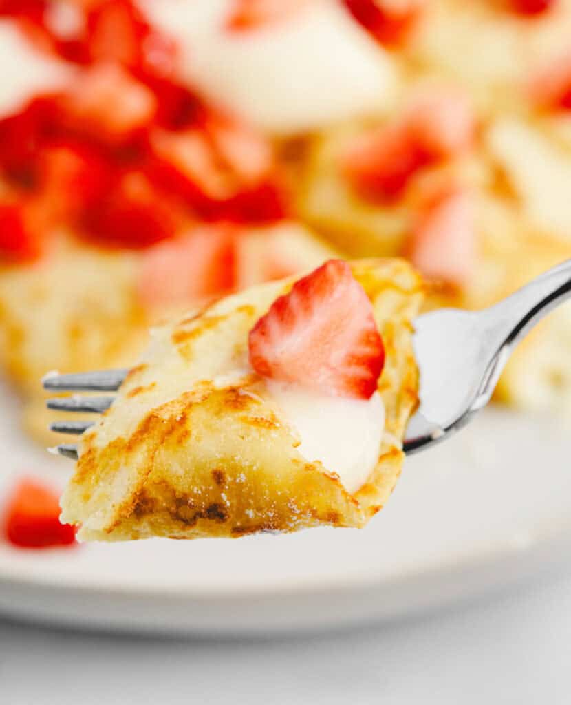 Crepes with Strawberries and Sweet Cream Cheese on Fork