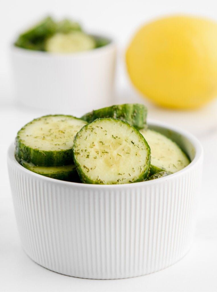 Cucumber Ranch Chips in Bowl with Lemon and More Cucumbers in the Background